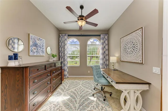 a kitchen with lots of counter top space appliances and cabinets