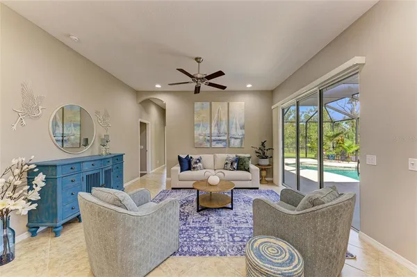 a living room with furniture and a large window
