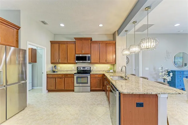 a bathroom with a sink a large mirror and a shower