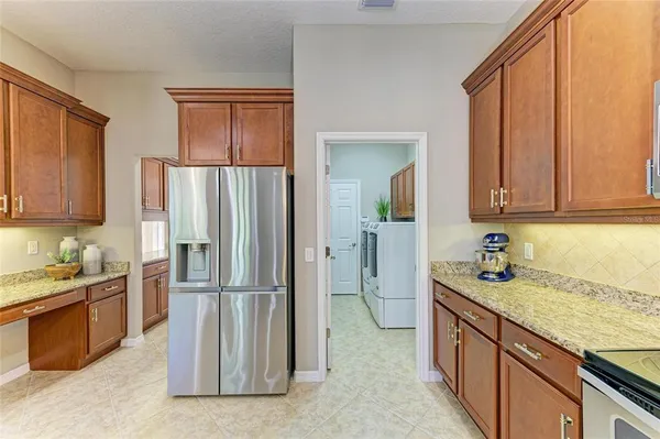 a bedroom with a bed and a ceiling fan