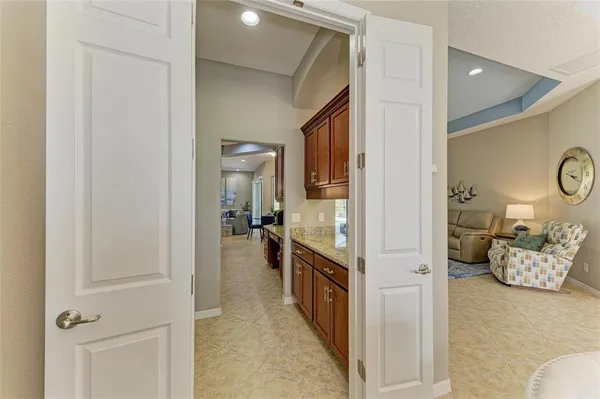 a bed room with a bed and a ceiling fan