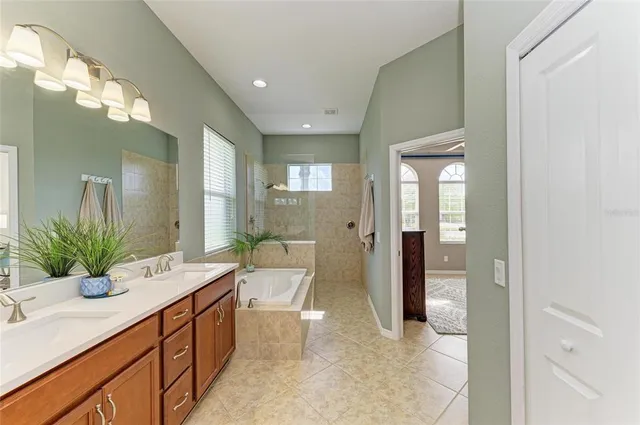 a view of a backyard patio with swimming pool