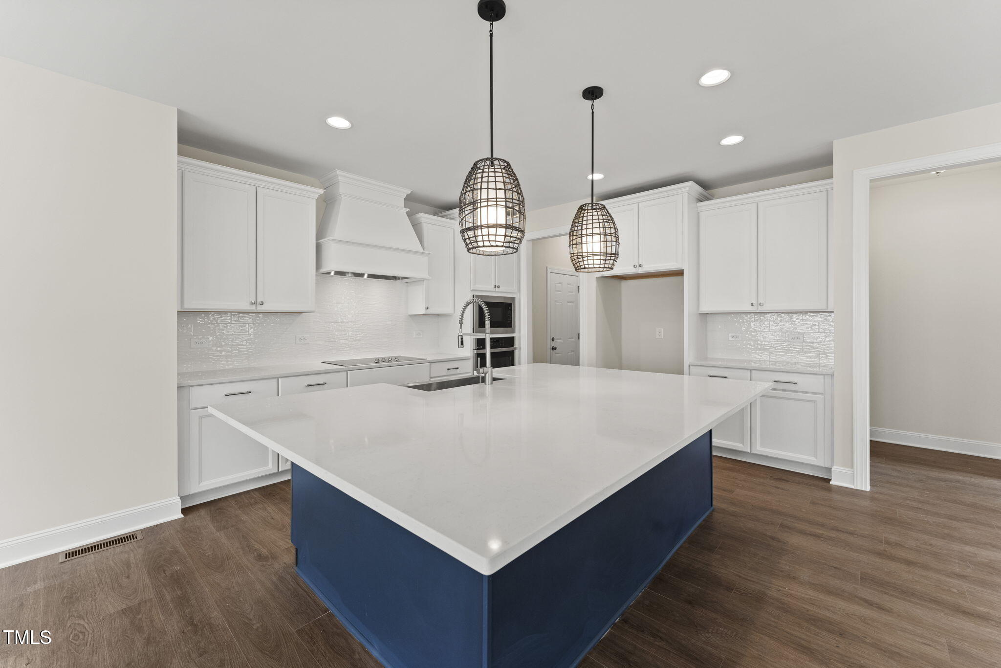 134 Ivy Rdg Road Chapel Hill, NC 27516 - Photo 11 of 37 a large white kitchen with wooden floor