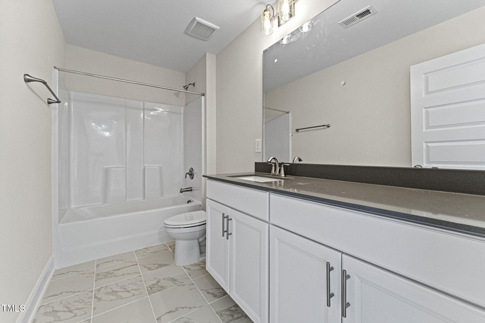 134 Ivy Rdg Road Chapel Hill, NC 27516 - Photo 29 of 37 a bathroom with a double vanity sink toilet and shower