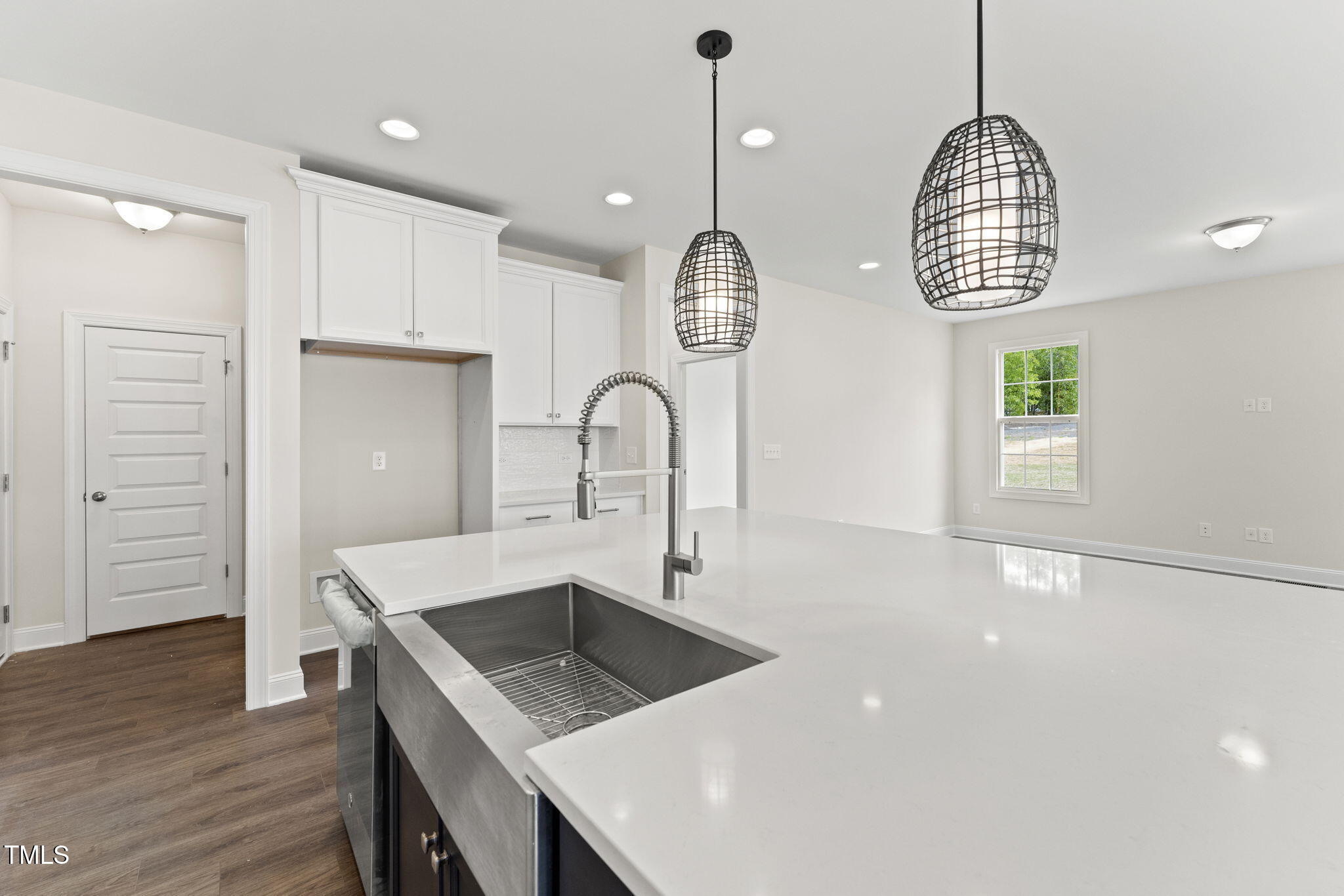 134 Ivy Rdg Road Chapel Hill, NC 27516 - Photo 10 of 37 a room with wooden floor and white cabinets