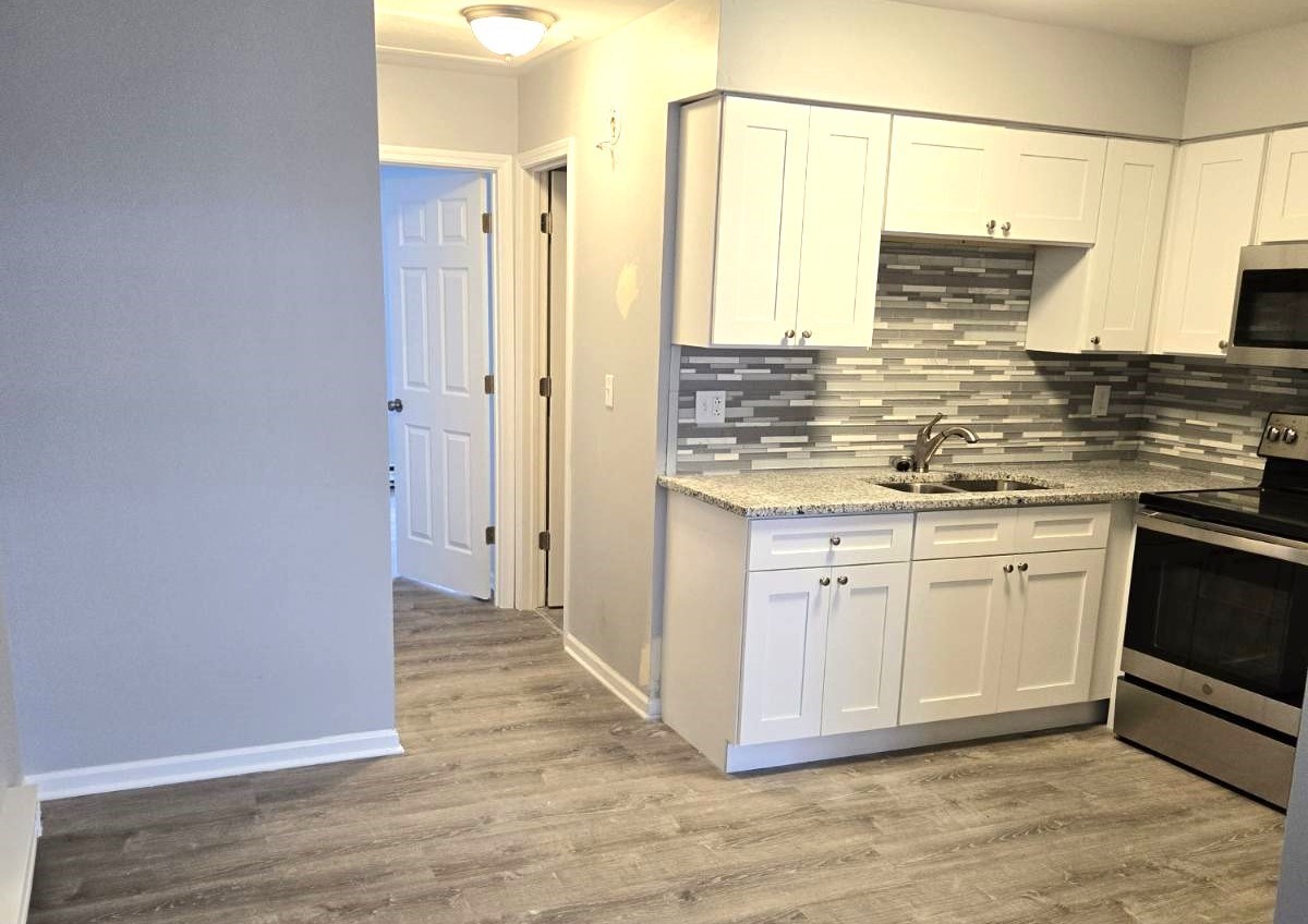1014 Bratton Avenue, Unit 3 Marseilles, IL 61341 - Photo 5 of 11 a kitchen with stainless steel appliances granite countertop a sink and a refrigerator