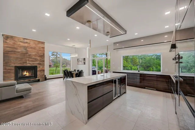 a bench sitting in a room next to a window