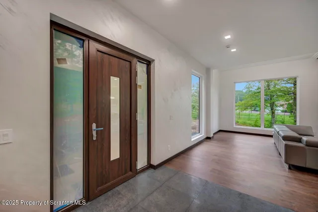 a view of a dining room with furniture window and outside view