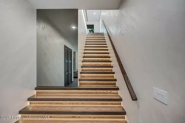 a kitchen with kitchen island a large window in it