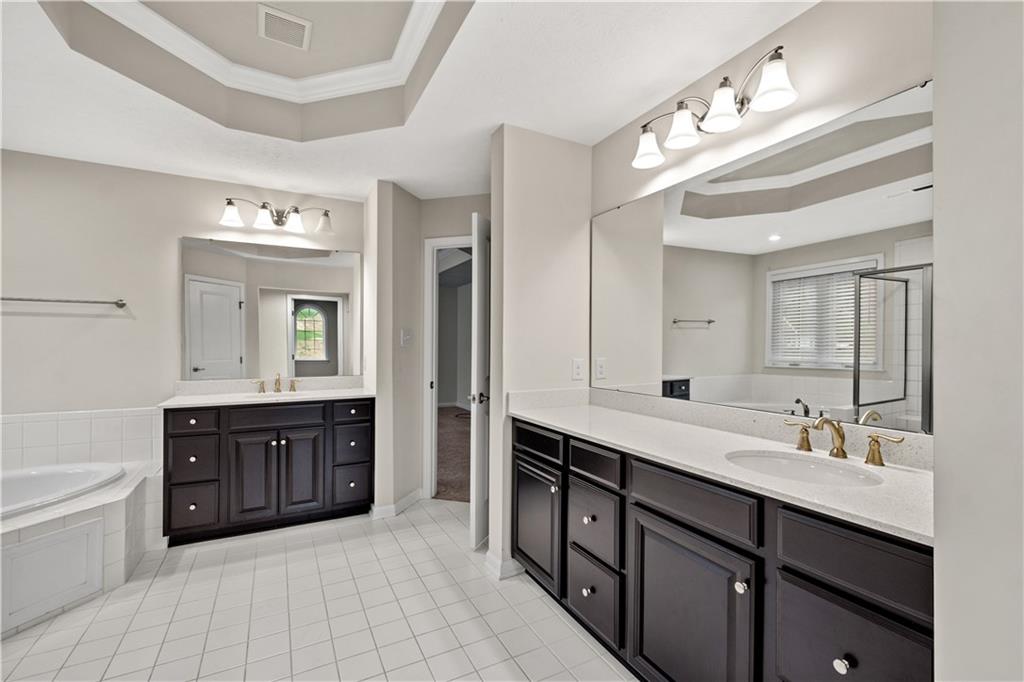 4441 Walnut Ridge Circle McDonald, PA 15057 - Photo 14 of 25 This oversized vanity is just one of the his & hers vanities in this ensuite, theres also a separate make-up spot! So much space!!