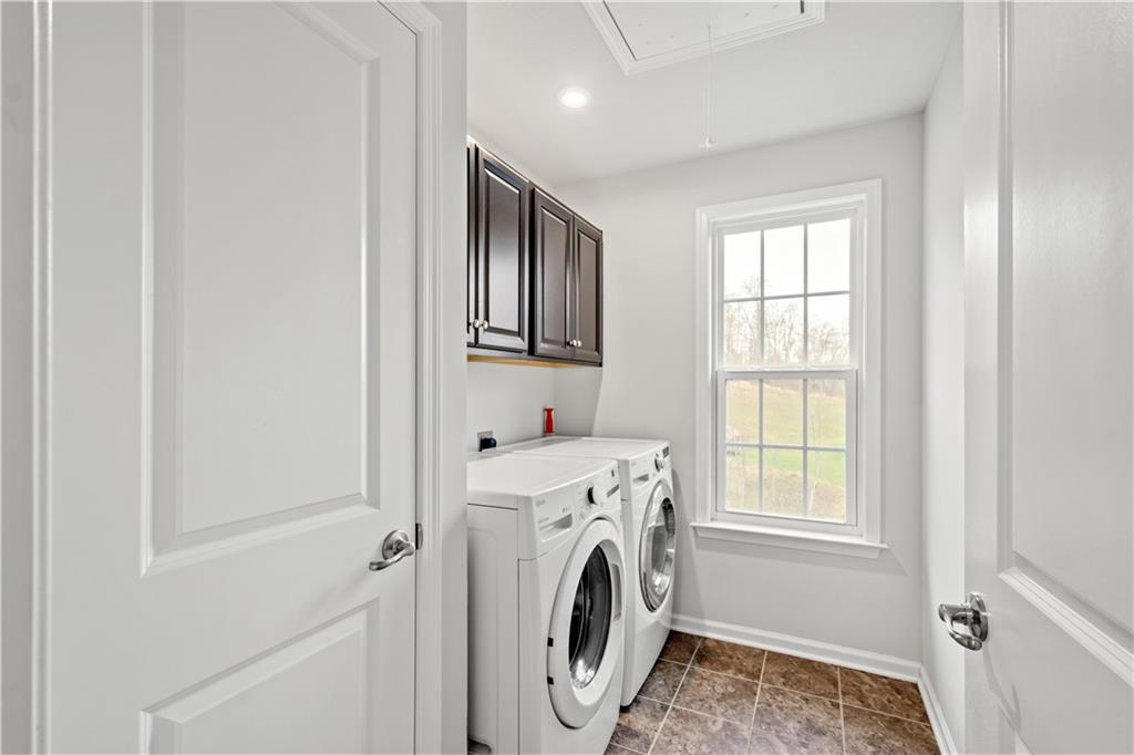 4441 Walnut Ridge Circle McDonald, PA 15057 - Photo 19 of 25 Convenient 2nd floor laundry room with cabinetry.