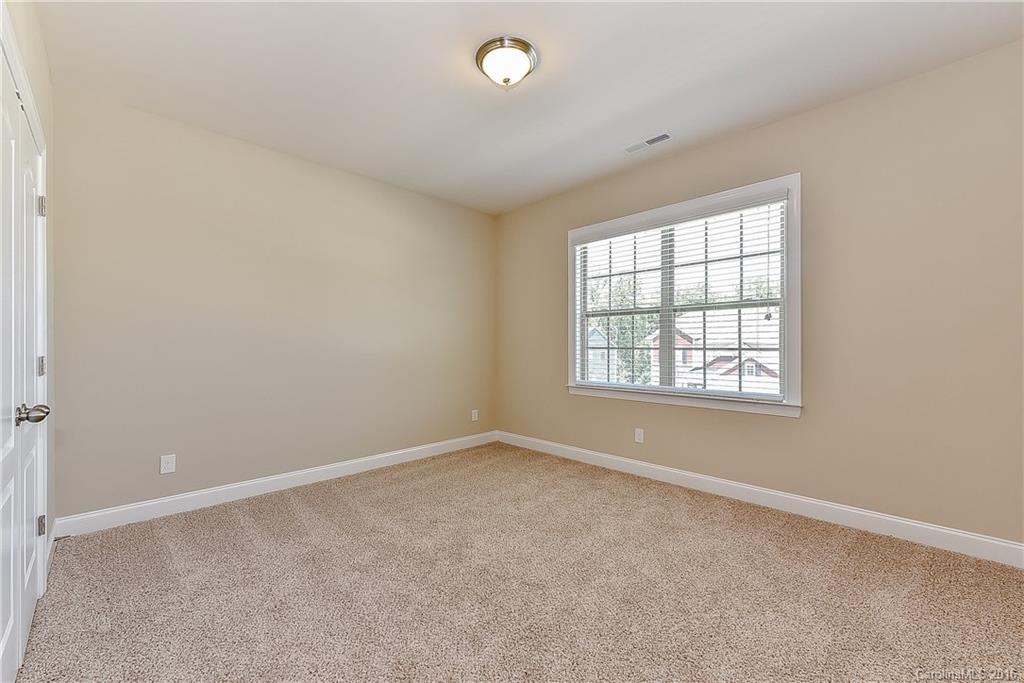 604 Brookhaven Drive, Unit HKC 95 Fort Mill, SC 29708 - Photo 18 of 24 an empty room with windows