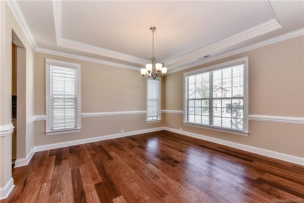 604 Brookhaven Drive, Unit HKC 95 Fort Mill, SC 29708 - Photo 5 of 24 a view of an empty room with wooden floor and a window