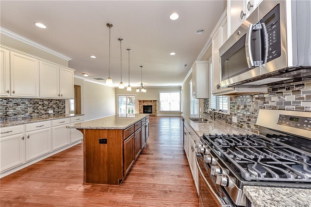 604 Brookhaven Drive, Unit HKC 95 Fort Mill, SC 29708 - Photo 8 of 24 a kitchen with stainless steel appliances granite countertop a stove a sink dishwasher and a refrigerator