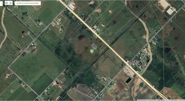 an aerial view of a residential houses with outdoor space