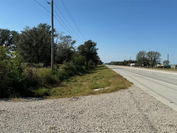 a view of a road with a building in the background