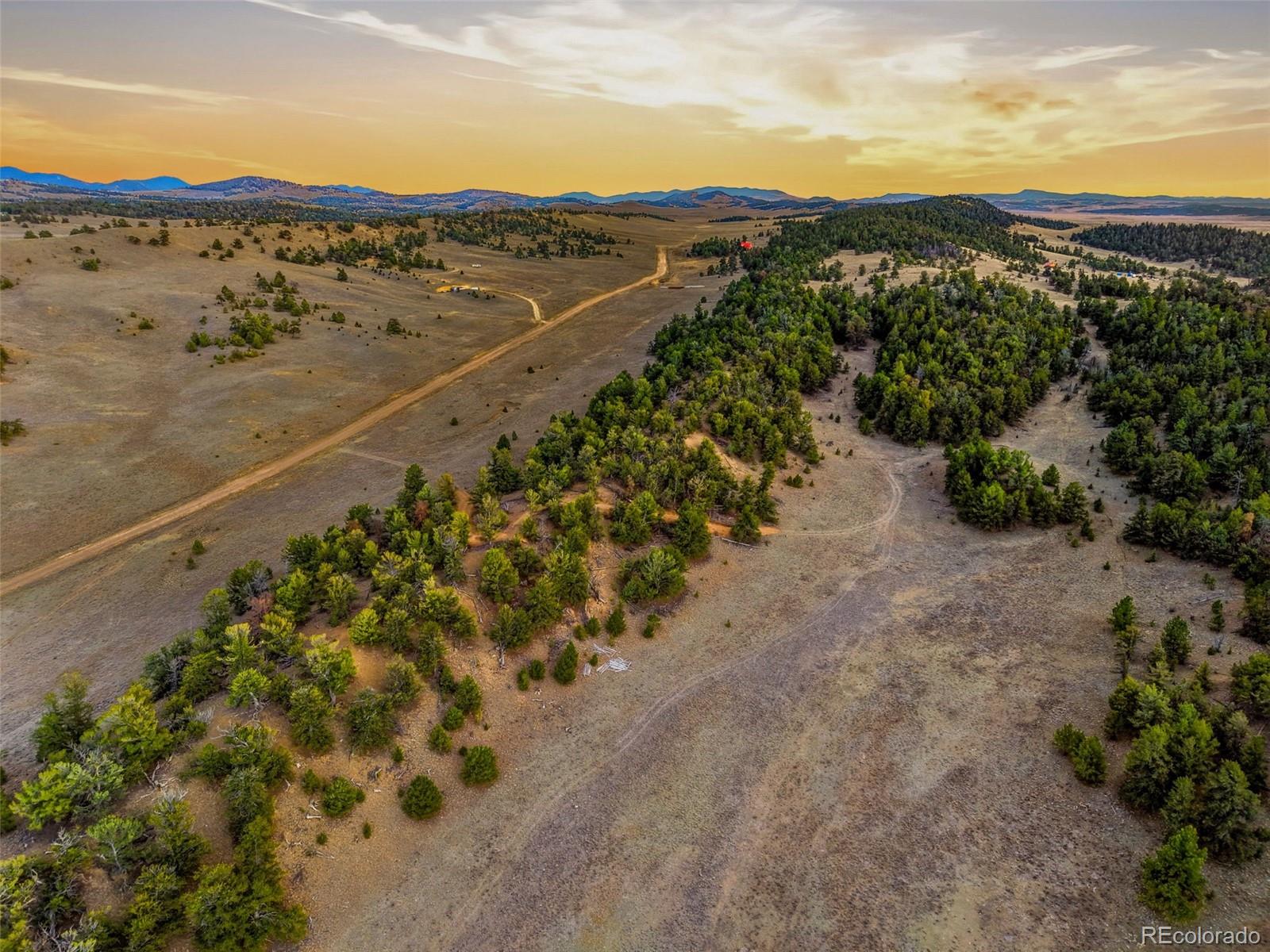 585 Vaquero Way Como, CO 80432 - Photo 9 of 18 a view of a city with mountains in the background