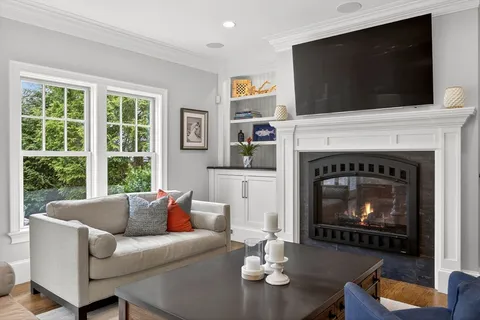 a bedroom with furniture and a flat screen tv