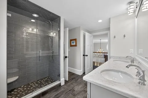 a bathroom with a bathtub and a shower