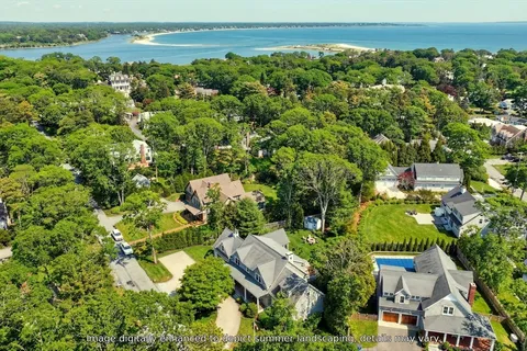 an aerial view of a house with a yard and garden