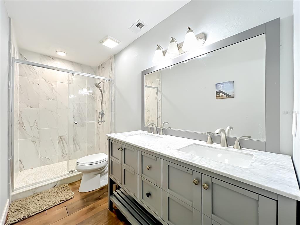 153 Variety Tree Circle Altamonte Springs, FL 32714 - Photo 35 of 44 a bathroom with a double vanity sink toilet and shower