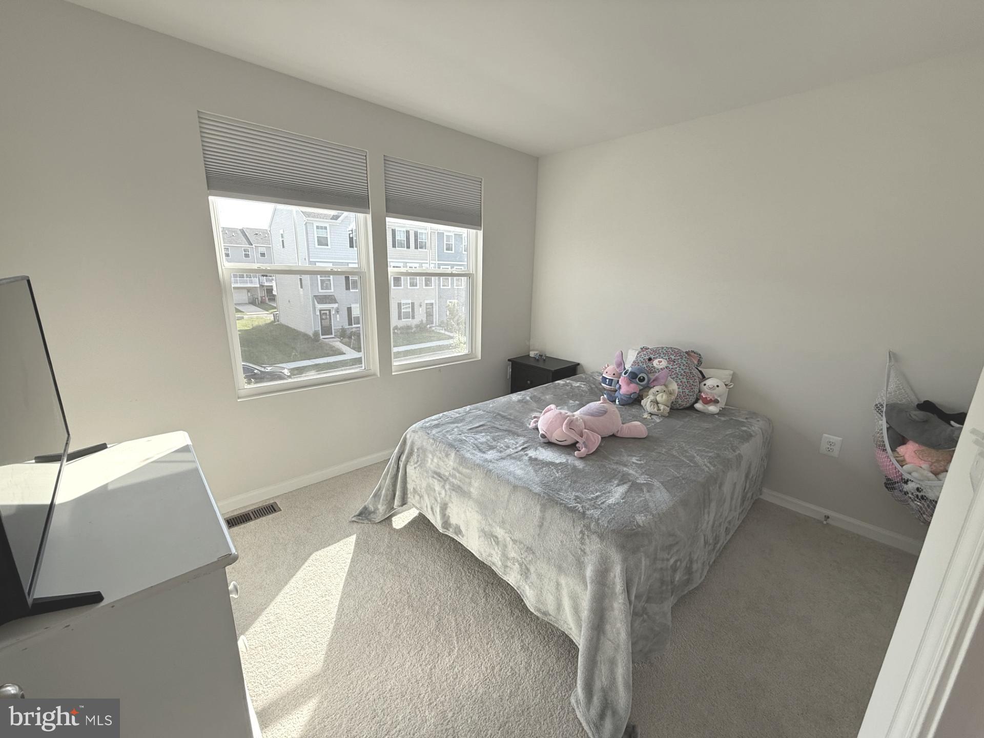 167 Coolidge Avenue Ranson, WV 25438 - Photo 11 of 20 a bedroom with a bed and a window