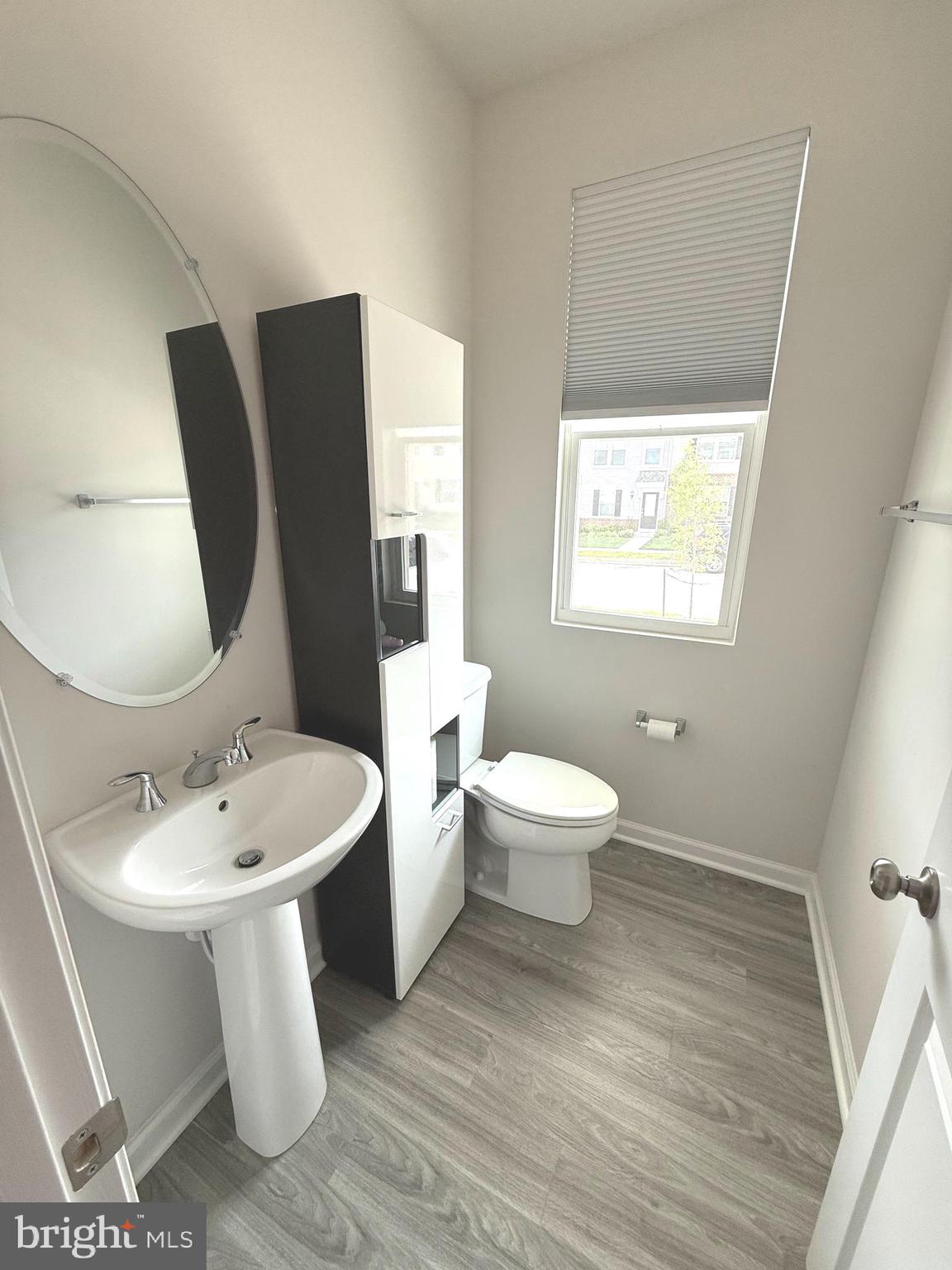 167 Coolidge Avenue Ranson, WV 25438 - Photo 7 of 20 a bathroom with a toilet sink and mirror