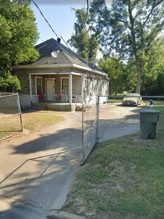 a front view of a house with swimming pool