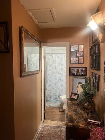 a bathroom with a toilet and a shower