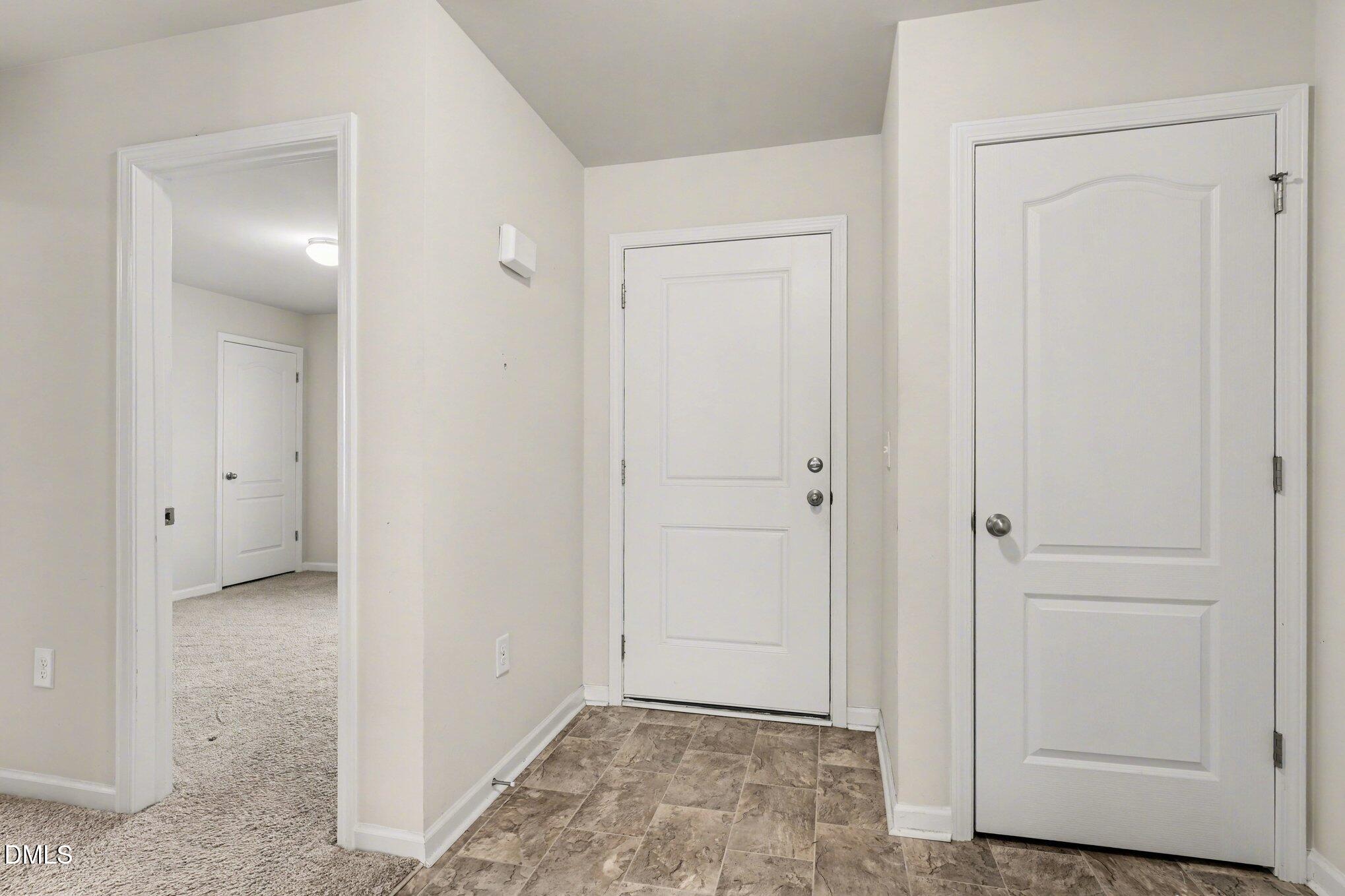 6003 Lowgrass Road Stedman, NC 28391 - Photo 12 of 24 a view of an empty room with closet and mirror