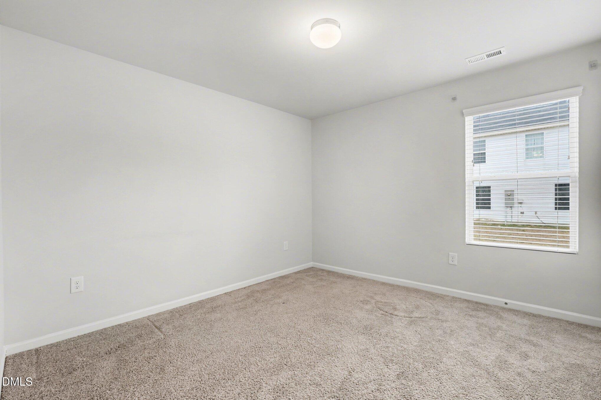 6003 Lowgrass Road Stedman, NC 28391 - Photo 15 of 24 an empty room with a window