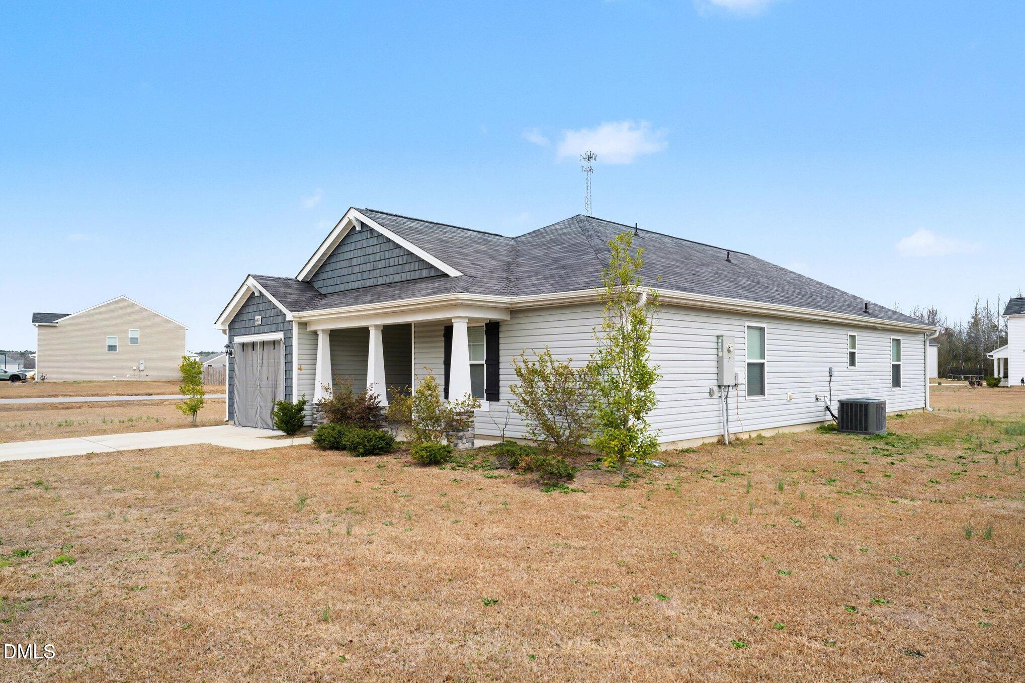 6003 Lowgrass Road Stedman, NC 28391 - Photo 21 of 24 a front view of a house with a yard