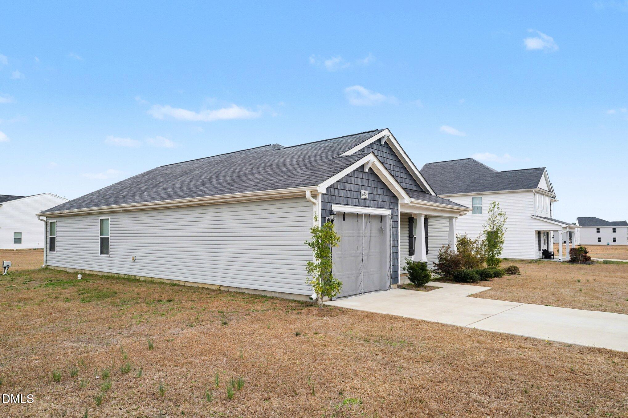 6003 Lowgrass Road Stedman, NC 28391 - Photo 22 of 24 a view of a house with a yard