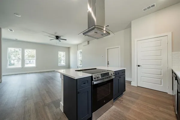 a kitchen with a sink and stove