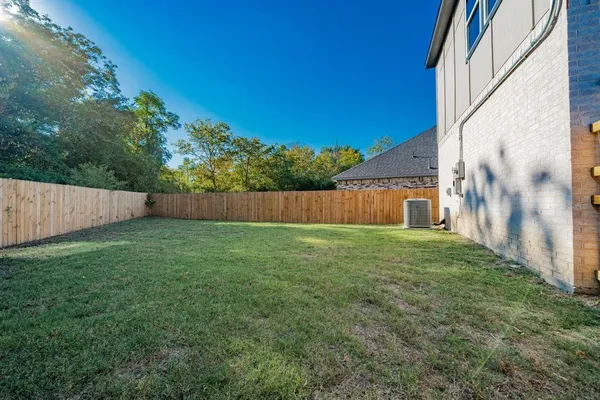 a view of house with yard