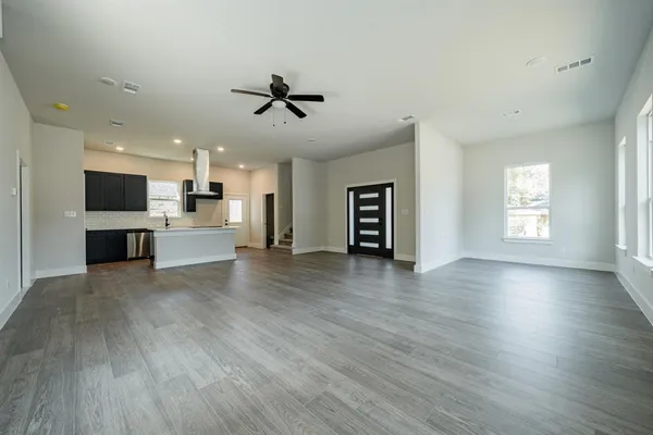 a view of a kitchen with a microwave and a stove top oven