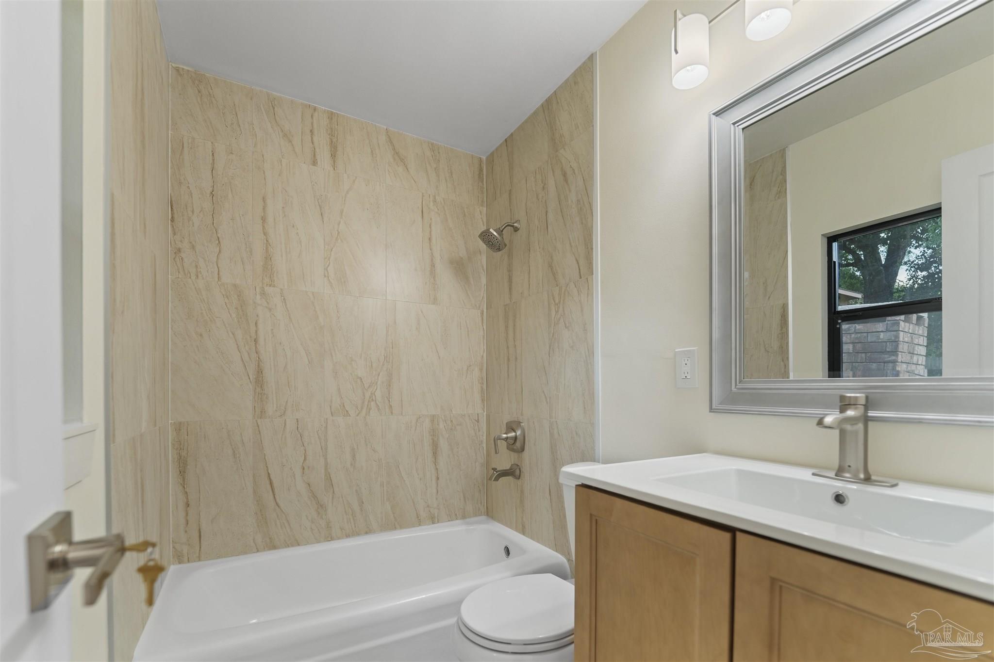 842 Belair Road Pensacola, FL 32505 - Photo 11 of 20 a bathroom with a sink a toilet and shower