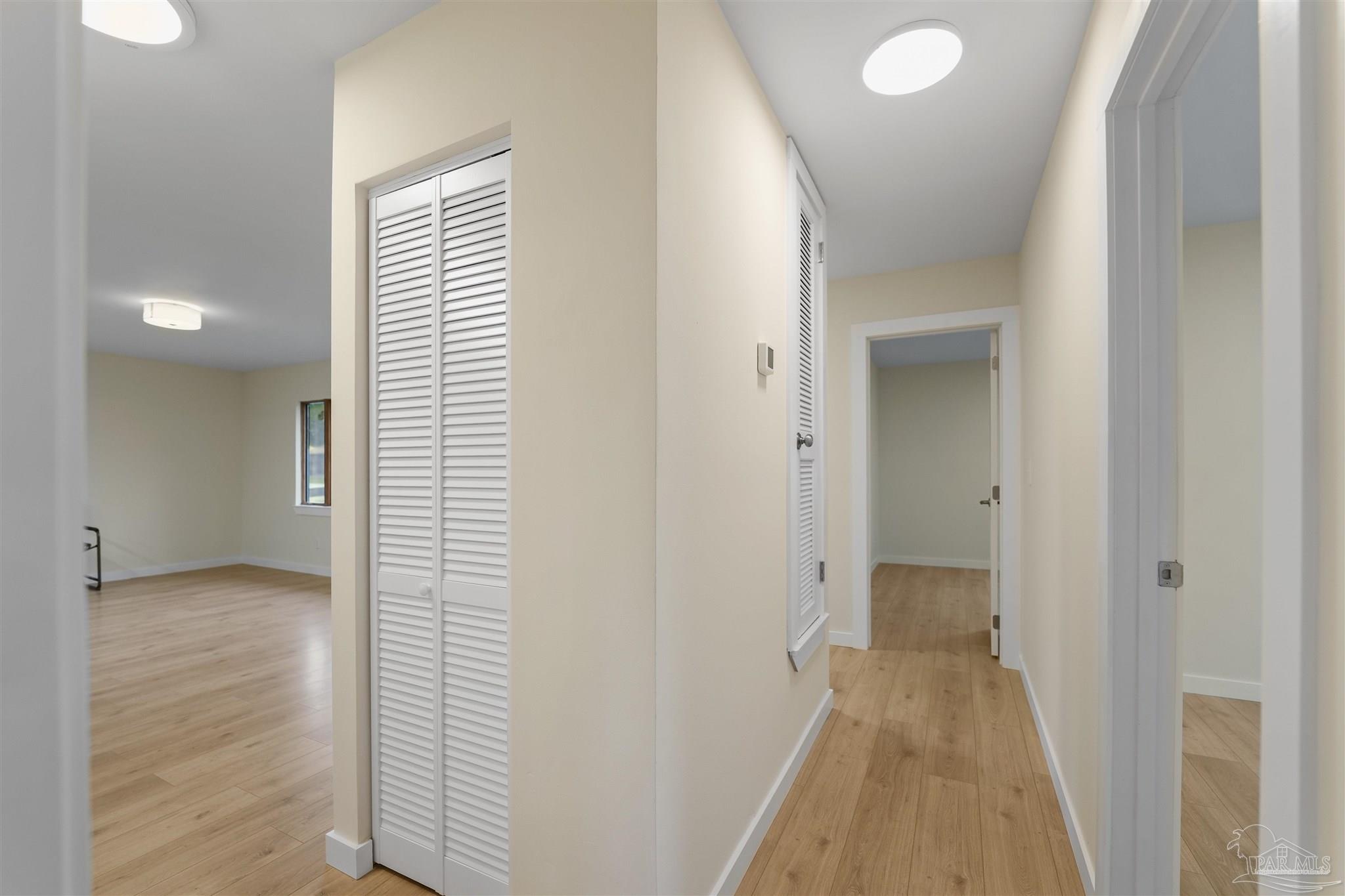 842 Belair Road Pensacola, FL 32505 - Photo 12 of 20 a view of a room with wooden floor and a bathroom