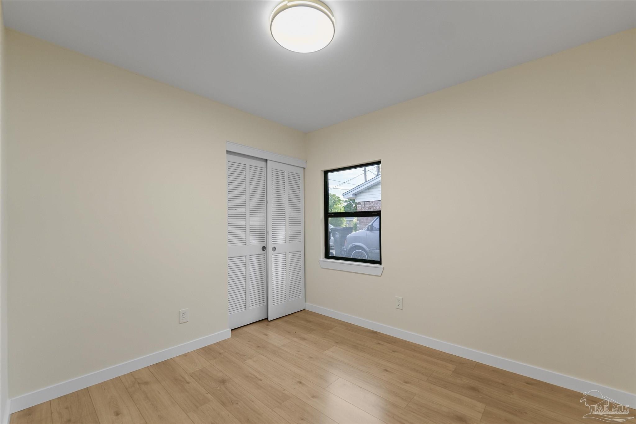 842 Belair Road Pensacola, FL 32505 - Photo 14 of 20 an empty room with windows