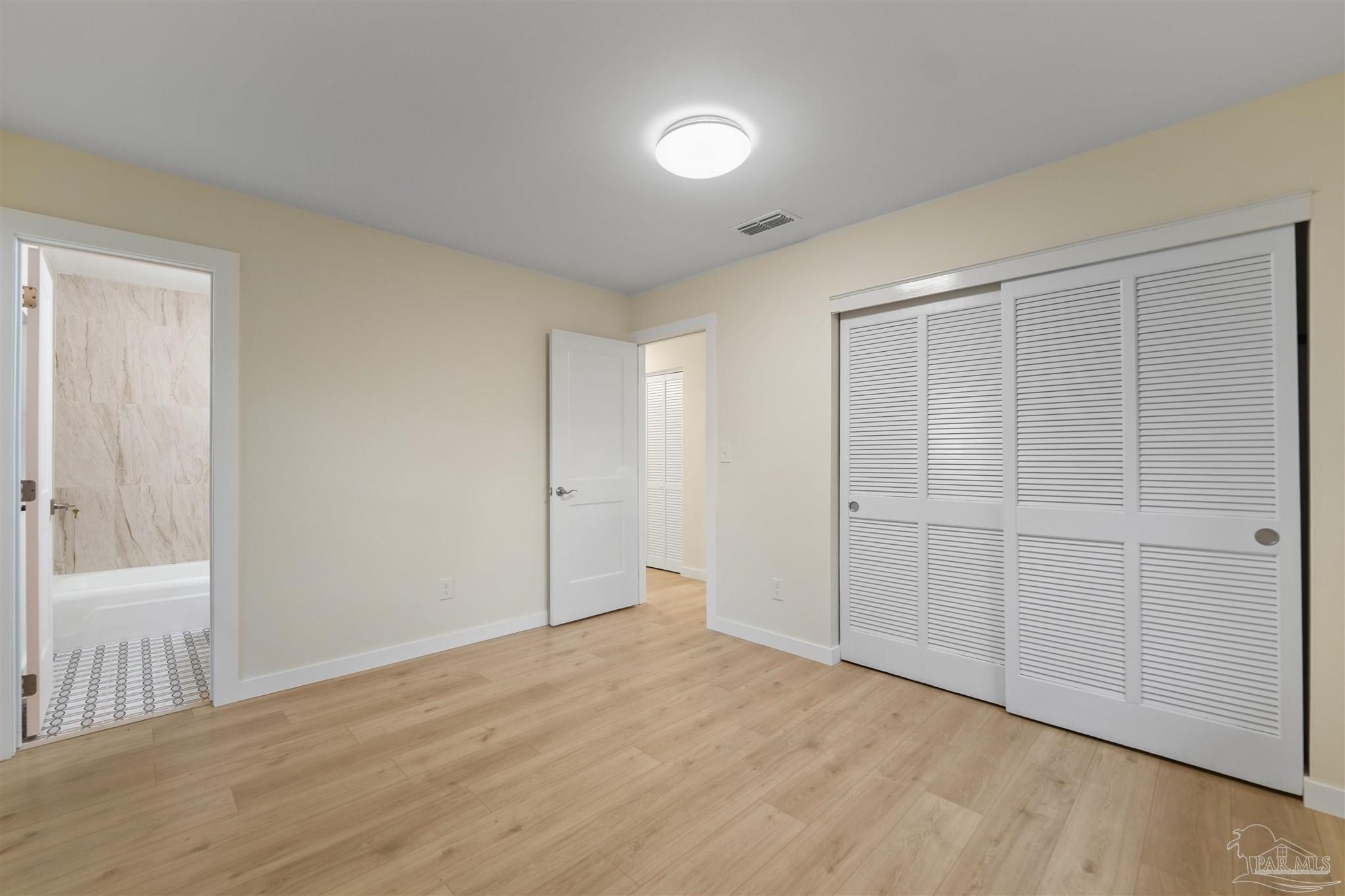 842 Belair Road Pensacola, FL 32505 - Photo 9 of 20 a view of empty room with wooden floor