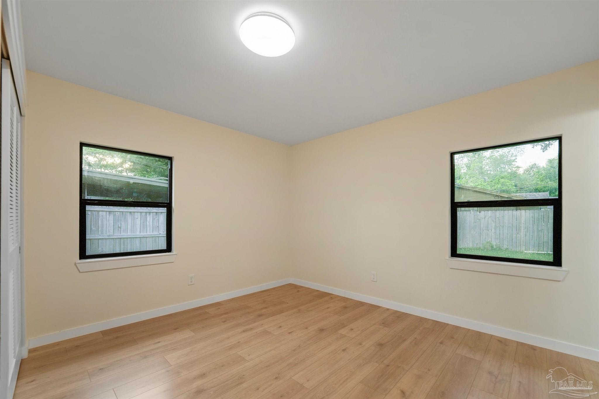 842 Belair Road Pensacola, FL 32505 - Photo 10 of 20 an empty room with a window