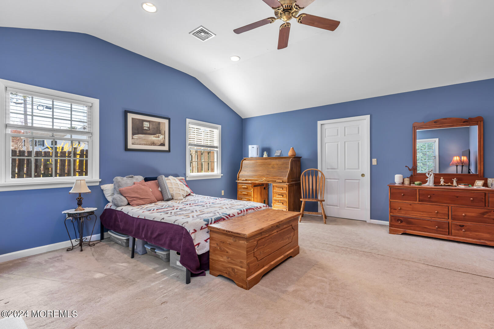 4 Cherry Tree Lane Middletown, NJ 07748 - Photo 16 of 31 a bedroom with a bed and a chandelier