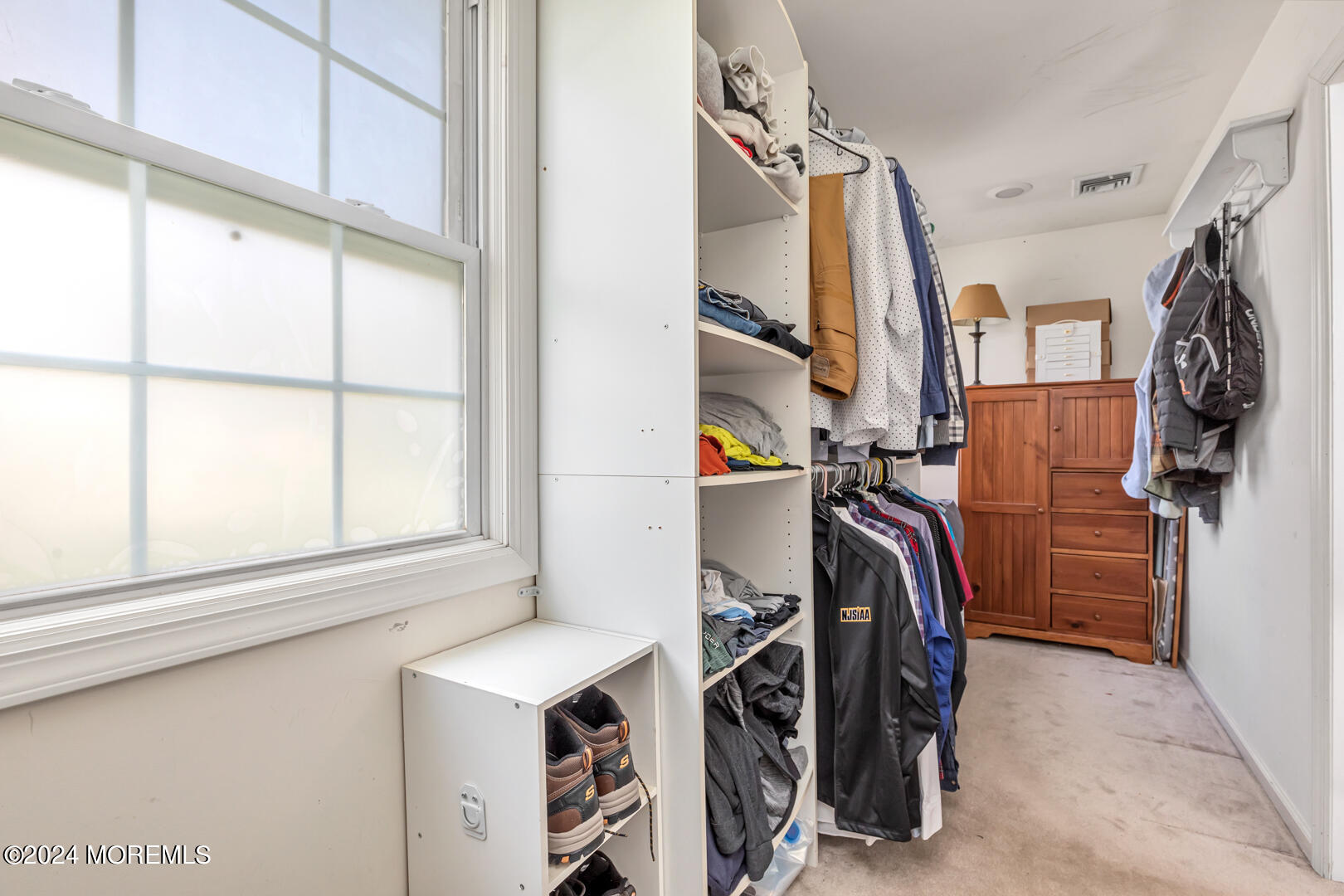 4 Cherry Tree Lane Middletown, NJ 07748 - Photo 18 of 31 a view of walk in closet with clothes and shoes
