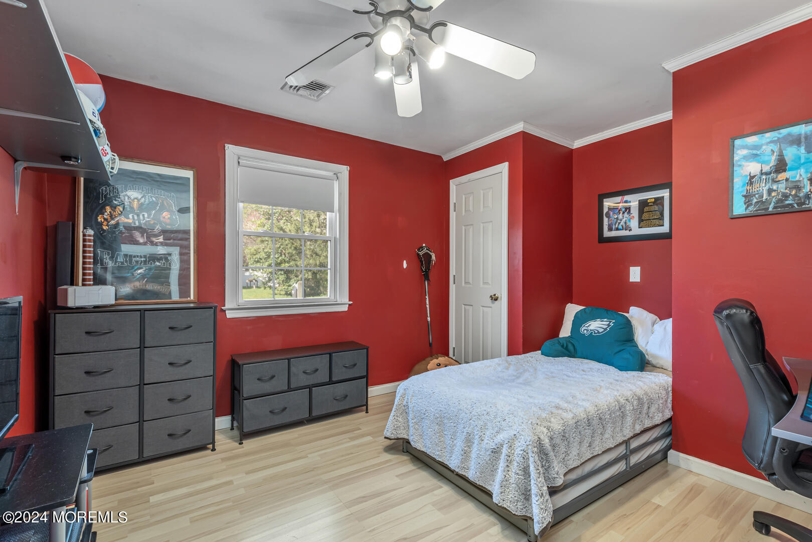 4 Cherry Tree Lane Middletown, NJ 07748 - Photo 20 of 31 a bedroom with a large bed and a chandelier