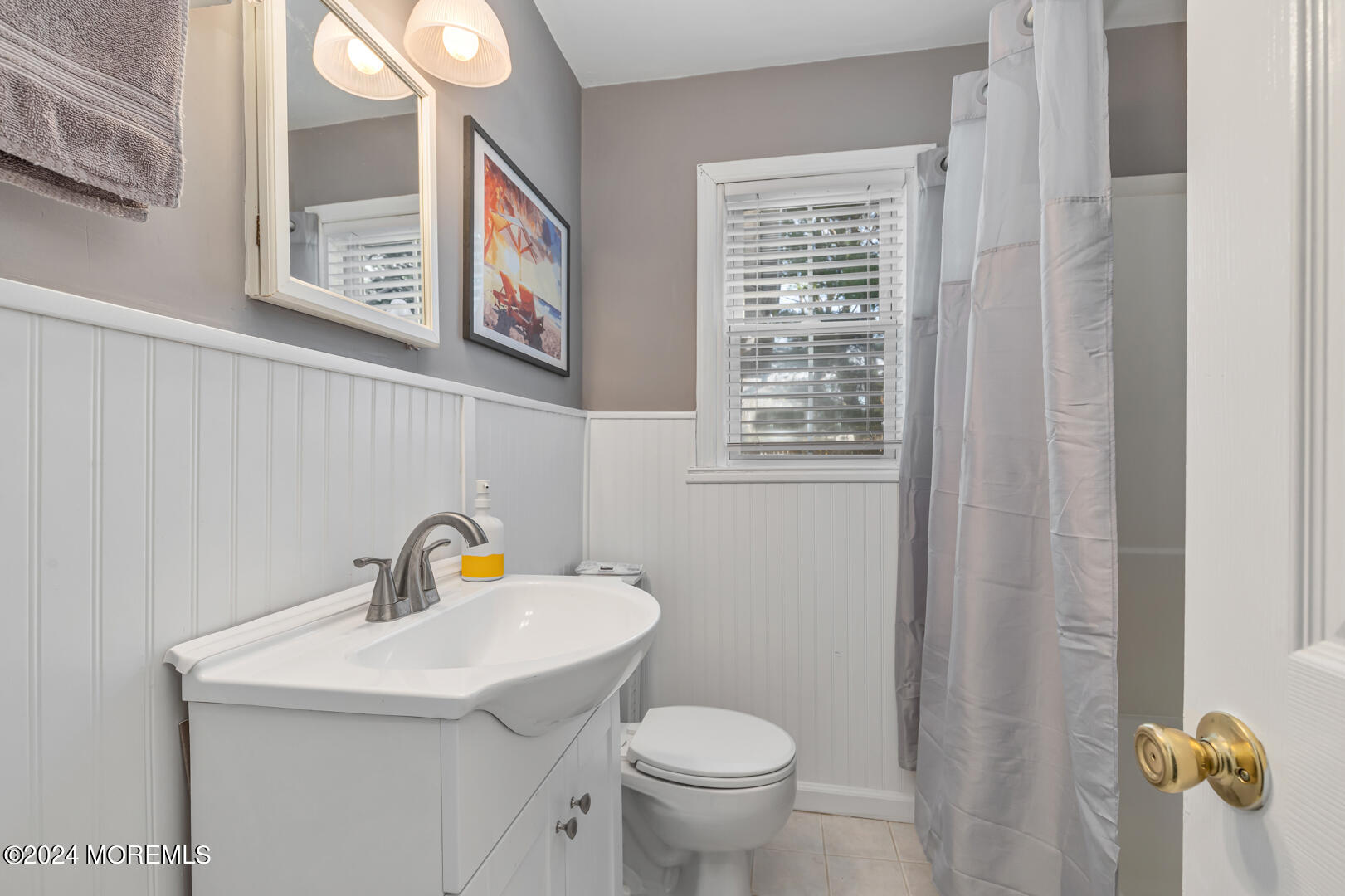 4 Cherry Tree Lane Middletown, NJ 07748 - Photo 22 of 31 a bathroom with a sink a toilet and a window