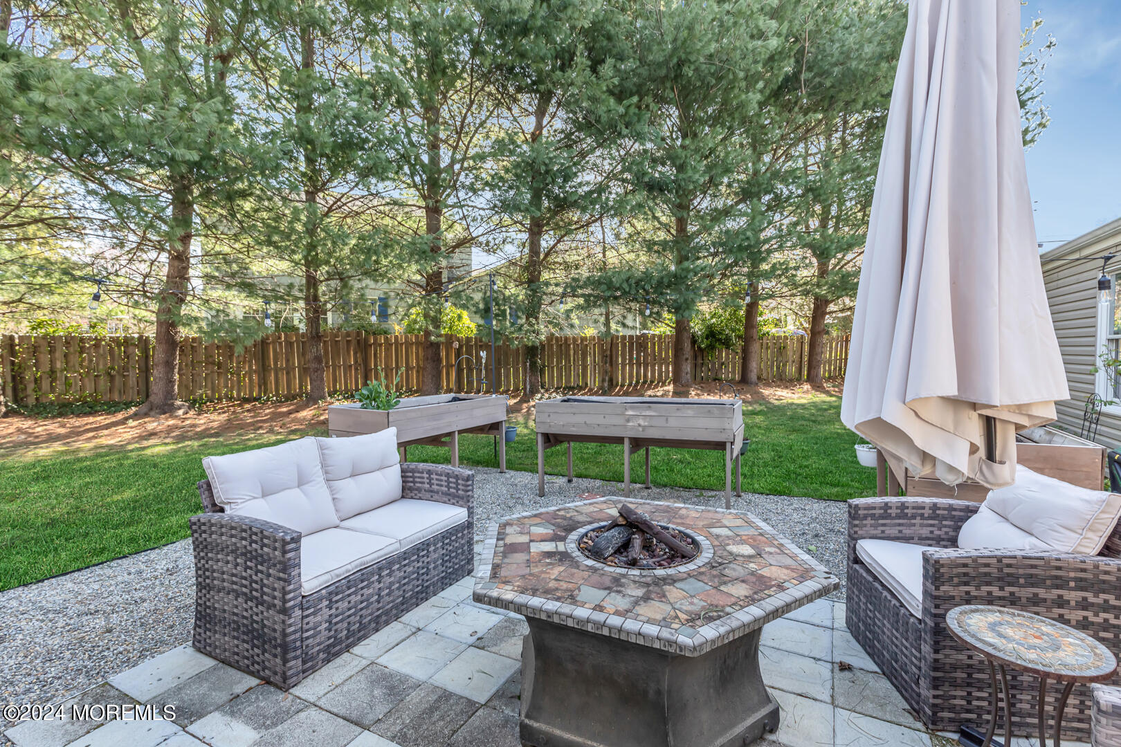 4 Cherry Tree Lane Middletown, NJ 07748 - Photo 25 of 31 a view of a patio with couches and a fire pit