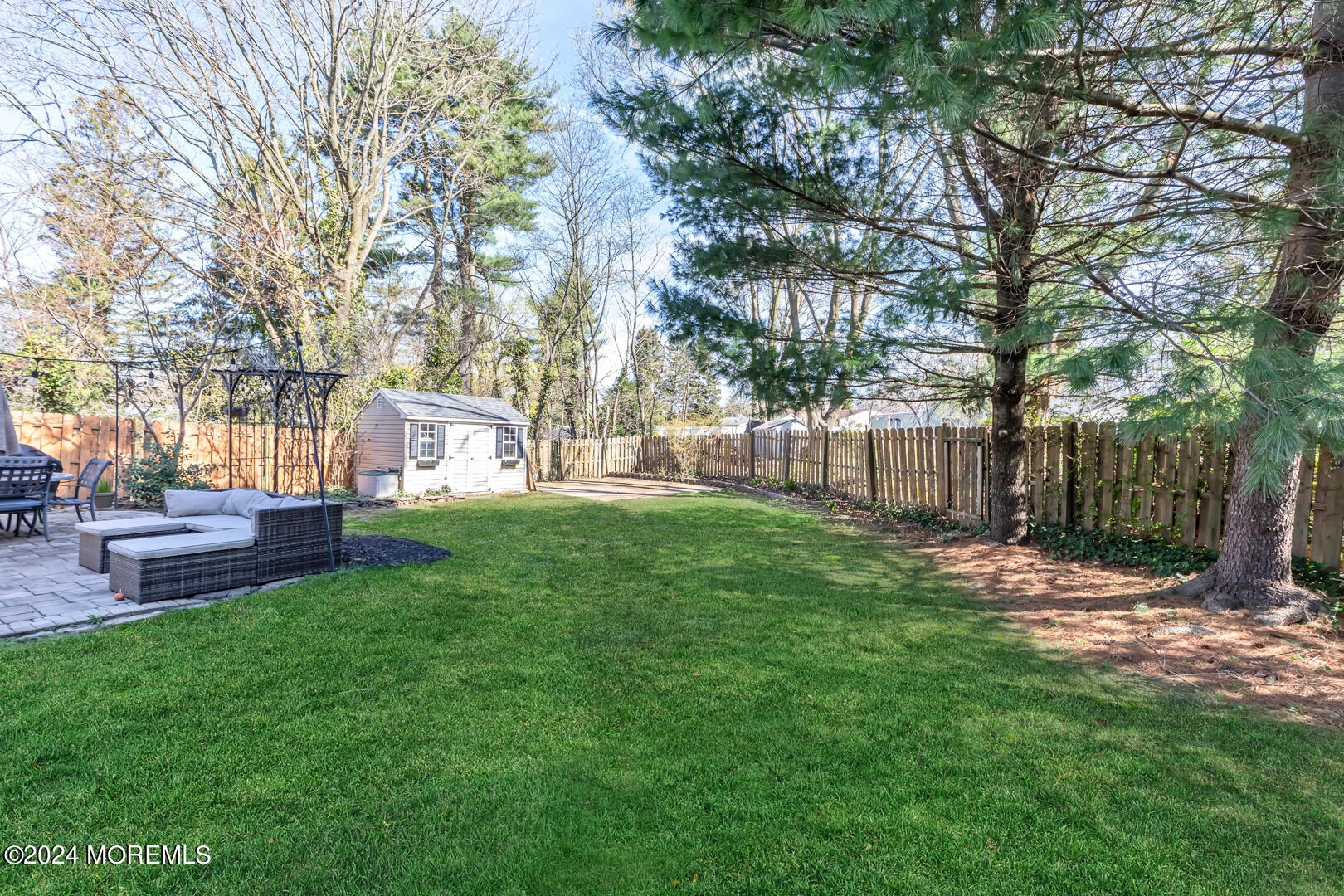 4 Cherry Tree Lane Middletown, NJ 07748 - Photo 27 of 31 a view of a yard with a table and chairs and a large tree