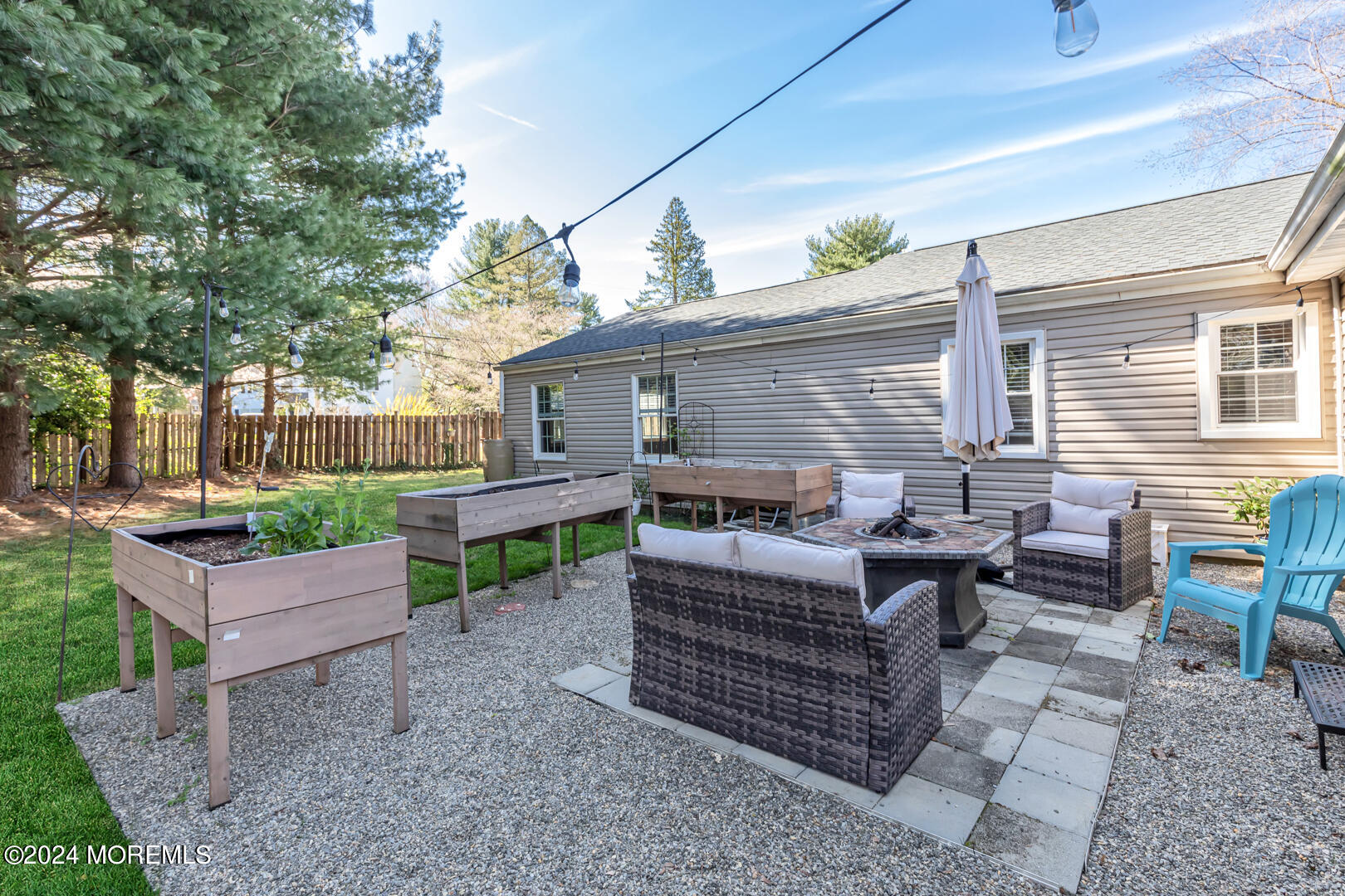 4 Cherry Tree Lane Middletown, NJ 07748 - Photo 28 of 31 a backyard of a house with barbeque oven table and chairs