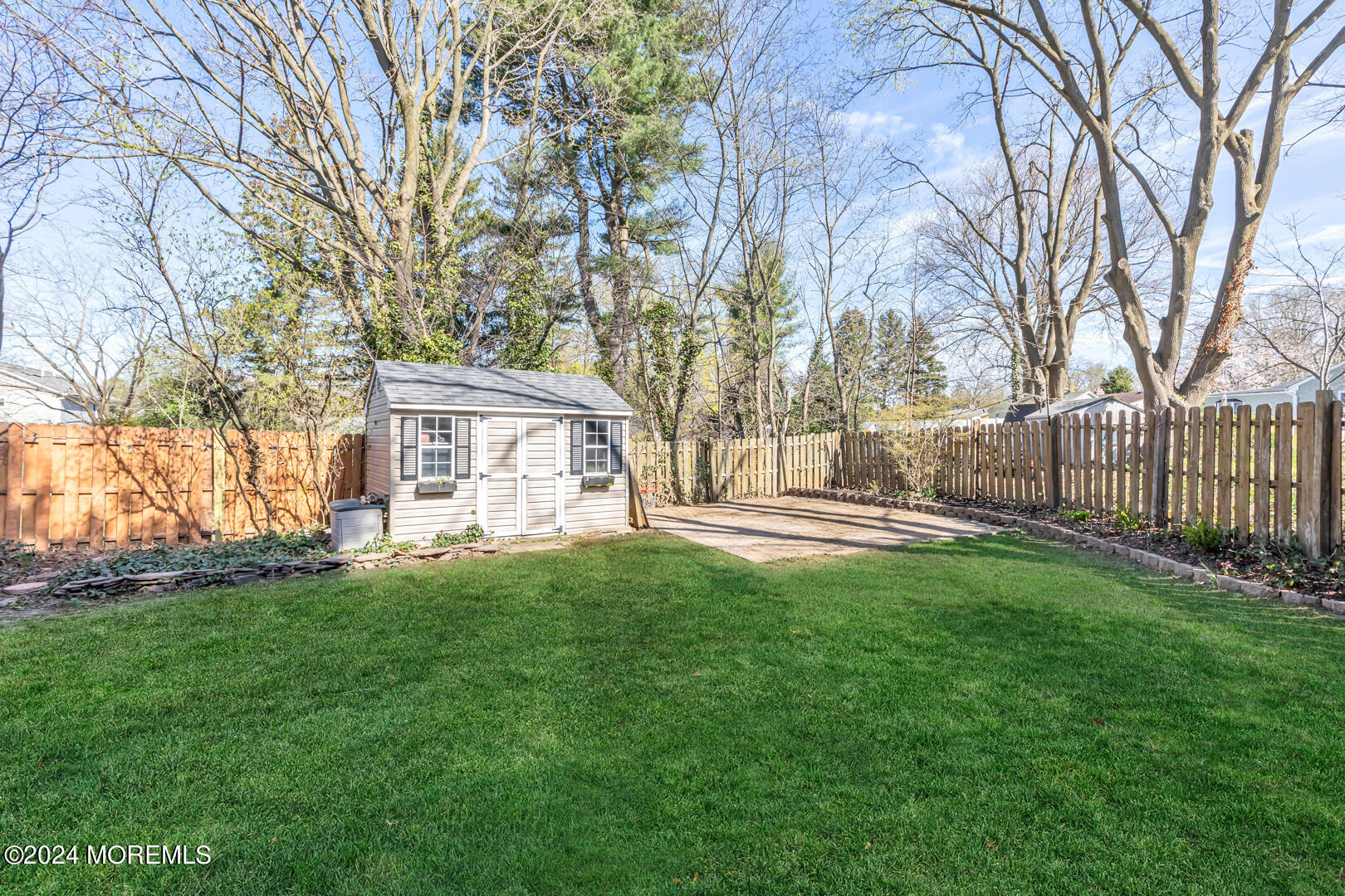 4 Cherry Tree Lane Middletown, NJ 07748 - Photo 30 of 31 a view of a house with backyard and a tree