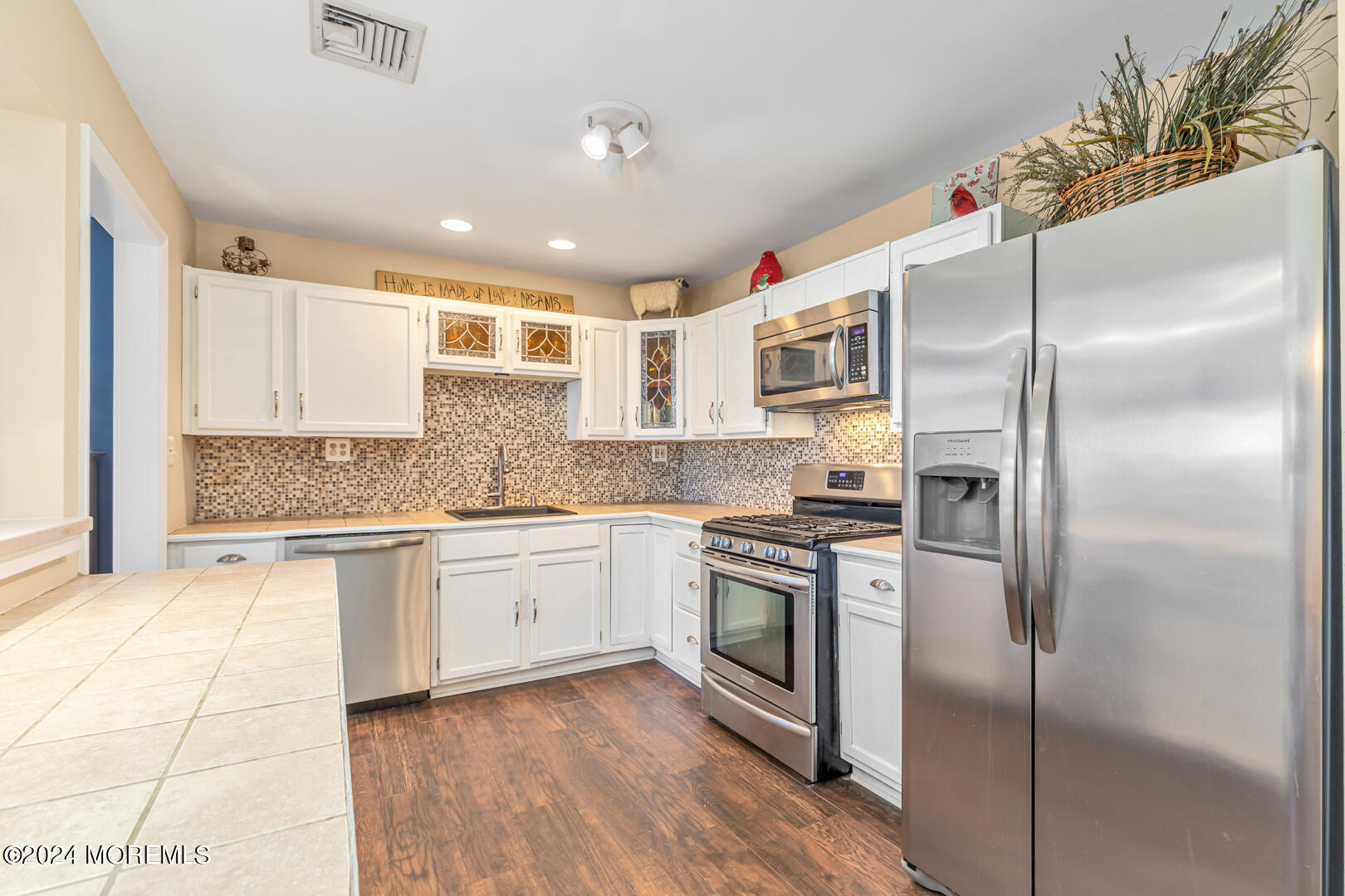 4 Cherry Tree Lane Middletown, NJ 07748 - Photo 7 of 31 a kitchen with stainless steel appliances granite countertop a stove a sink and a refrigerator